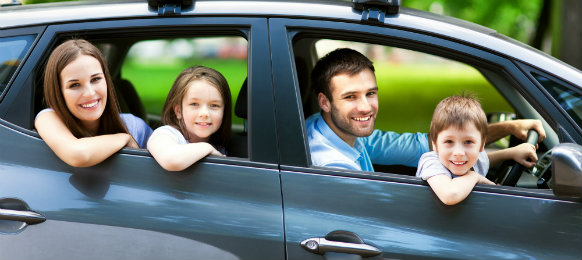 happy family posing before their road trip