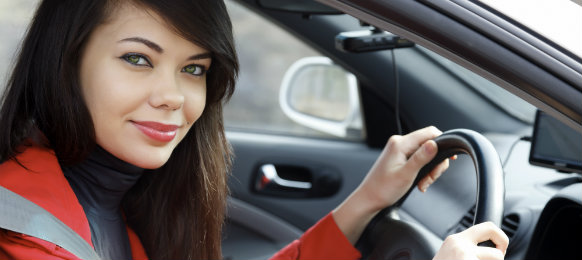 happy woman ready to drive her new car