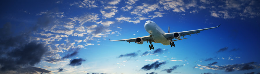 airplane flying over a clear sky