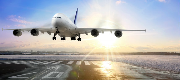 an aircraft landing in the airport terminal