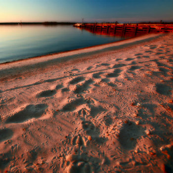 Beach and dock along shore of Lake Winnipeg