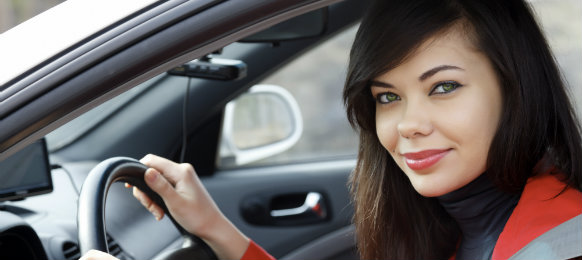 A gorgeous woman inside the car