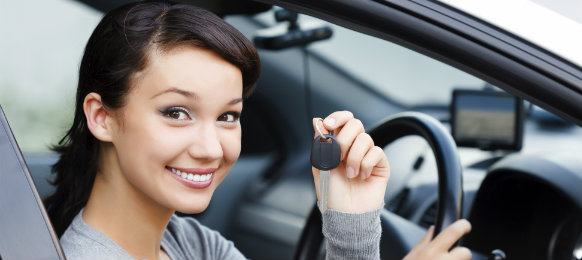 beautiful lady holding a car key