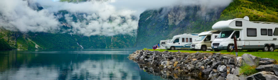 campervan on the side of the lake parked