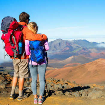 Couple hiking on the beautiful mountain trail in Hawaii
