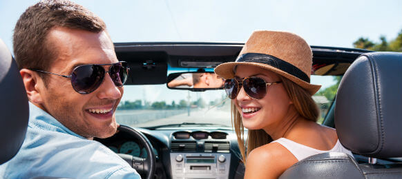 couple traveling in a car hire