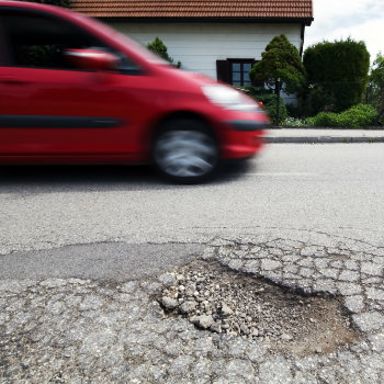driving beside pothole