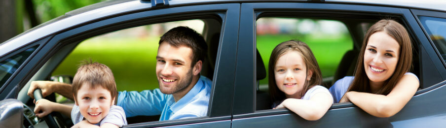 family traveling in a car rental to Daytona Beach