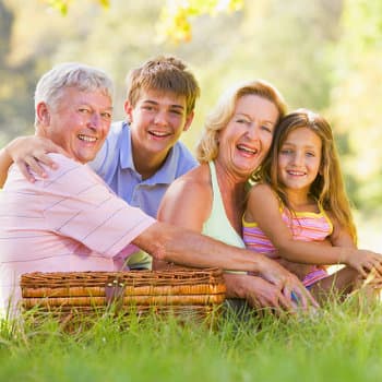 grandparents having picnic with grandchildren