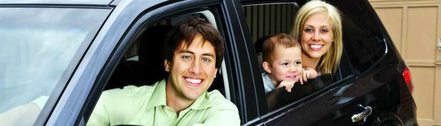 happy family inside black car