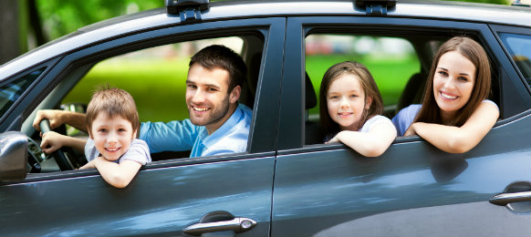 A happy family enjoying the road trip