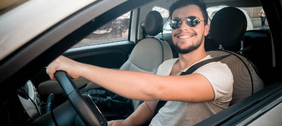 happy man inside the car rental