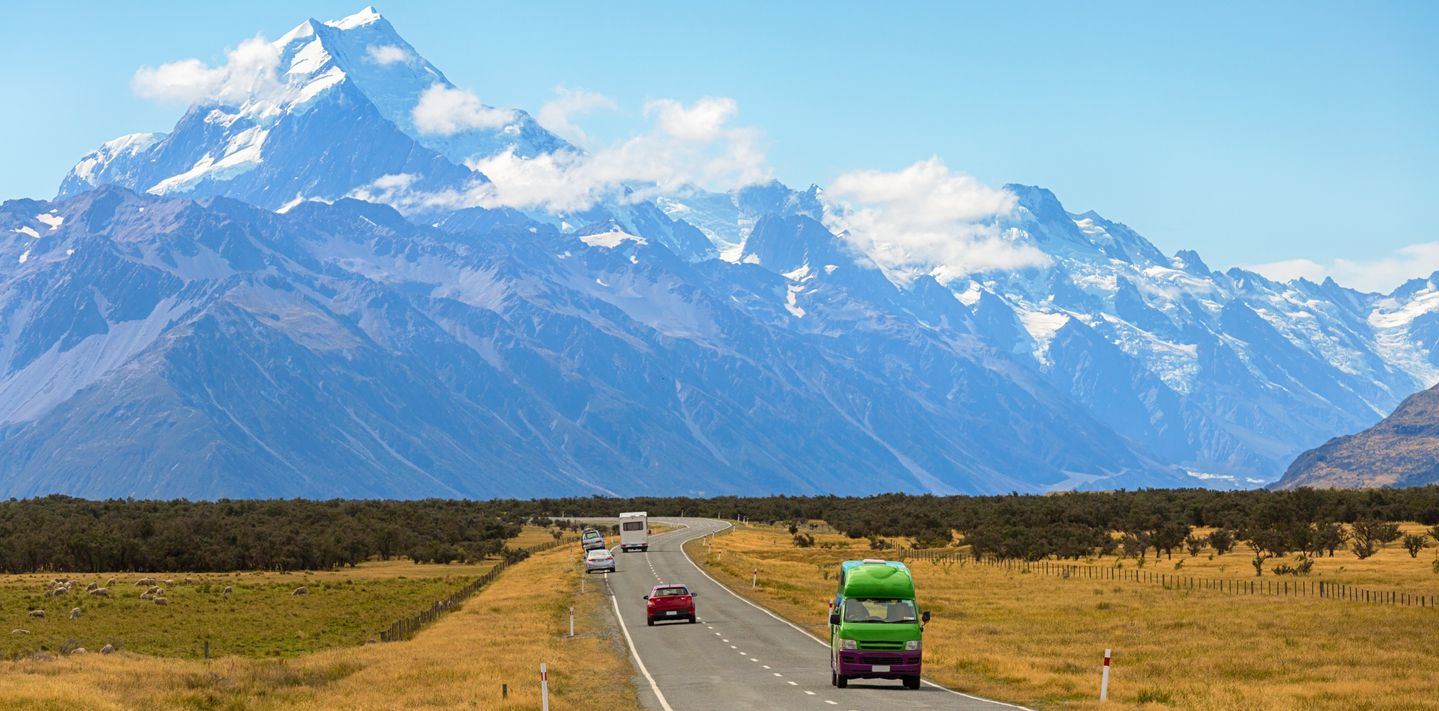 View of tourist driving car on the road leading to Mount Cook, New Zealand