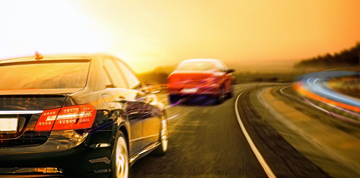 Speeding cars.