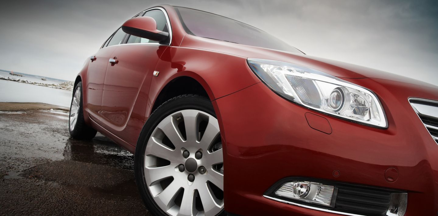 A cherry red luxury car.