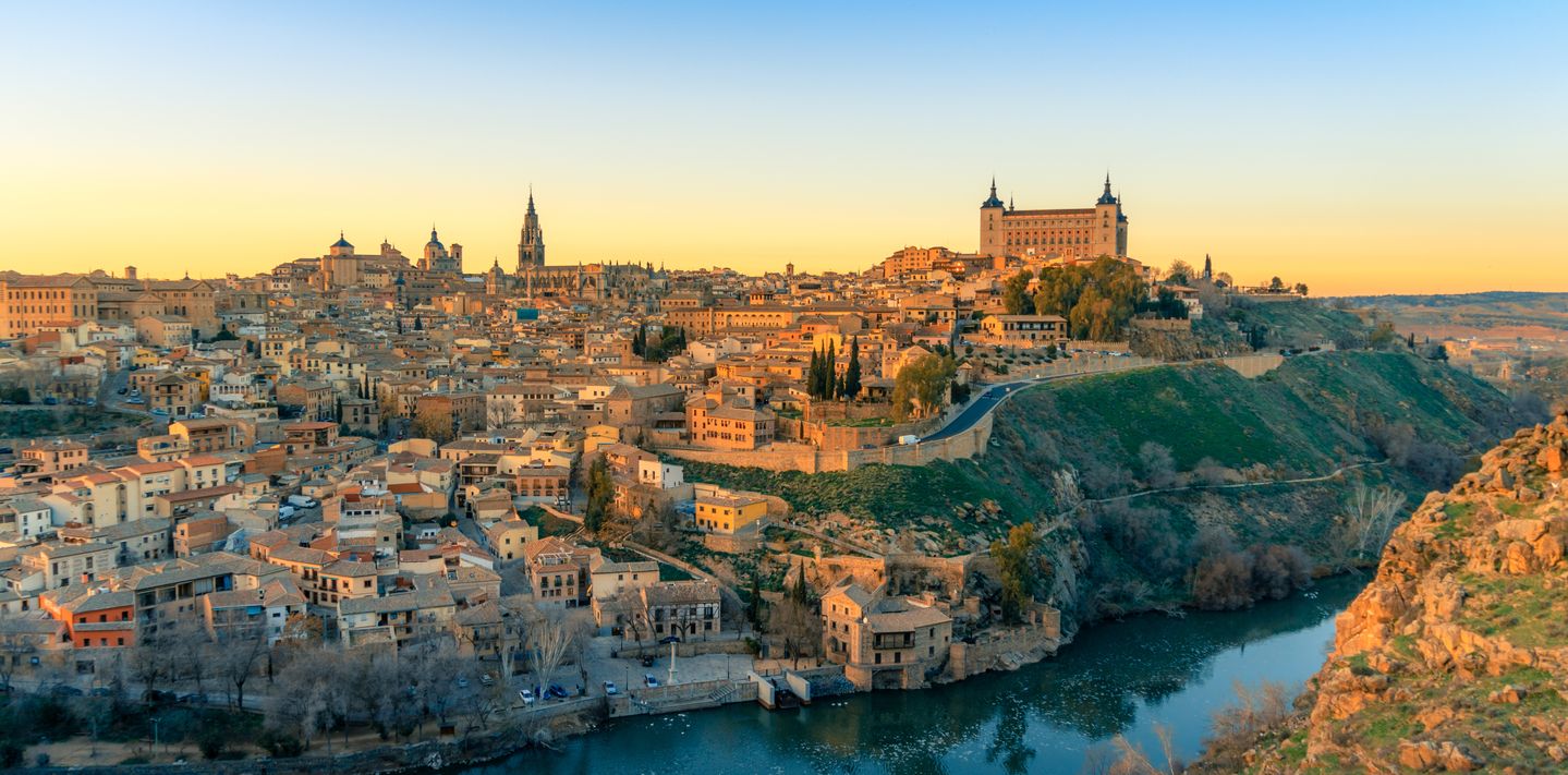 Breathtaking panoramic view of beautiful sunset over the old town of Toledo.