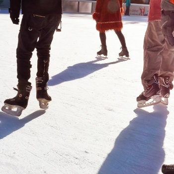 ice skaters at the rocketfeller ice skating rink