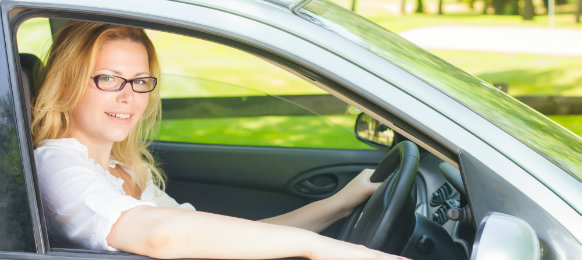 intellectual woman driving a car hire