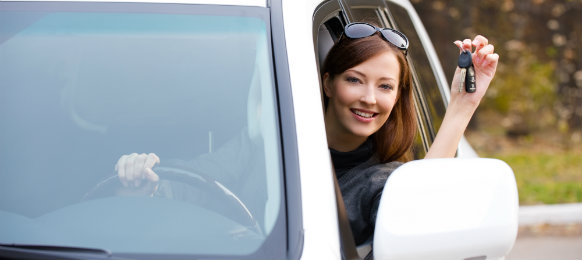 pretty woman showing her car key