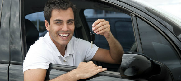 happy guy holding car key