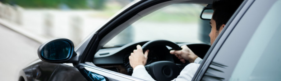 businessman driving his car rental