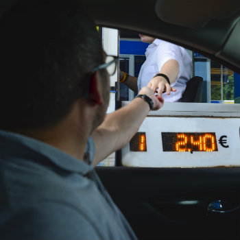 man paying the toll fee