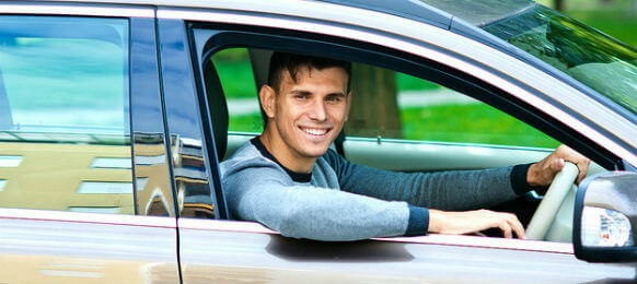 man sitting in car rental