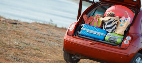 packed things for fun swimming activity inside a car rental