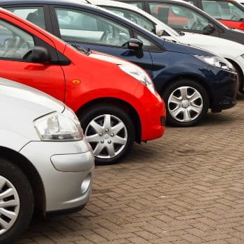 Rental cars parked at the hire car depot