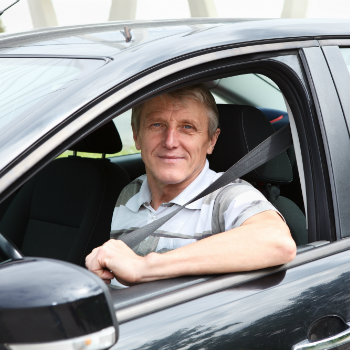 senior man driving a car
