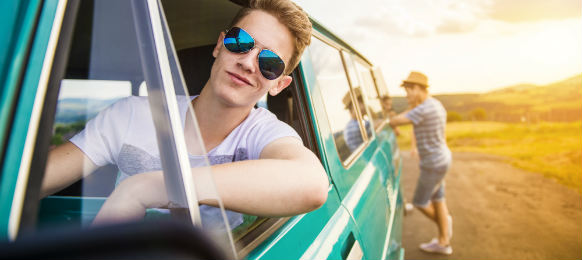 smiling man parked with his friend
