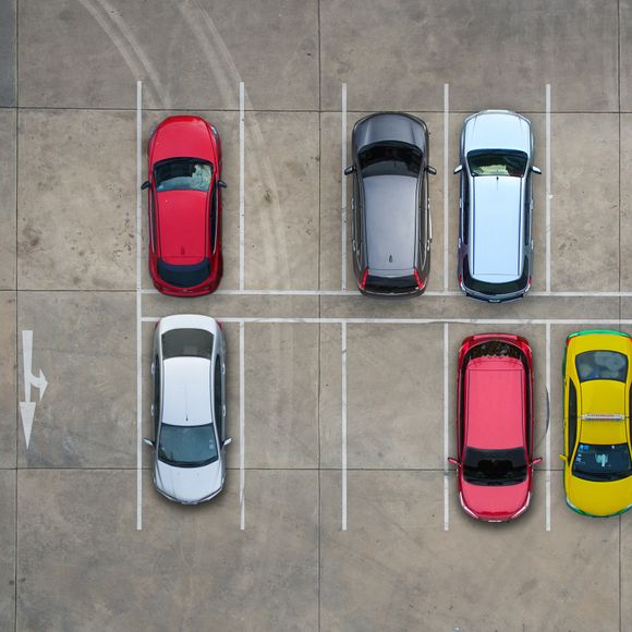 Aerial view of cars in a parking lot.