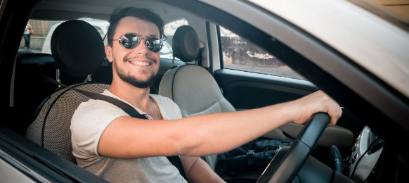 stylish man driving a car hire