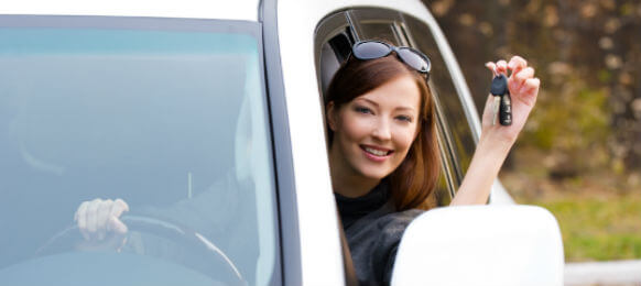successful woman showing carhire key
