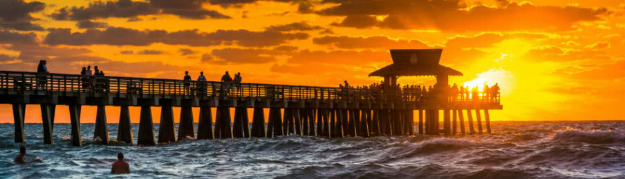 sunset over the fishing pier in naples, florida