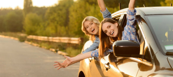two girls enjoying the road trip