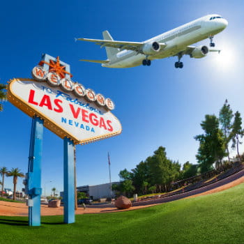 Welcome sign at Las Vegas with airplane