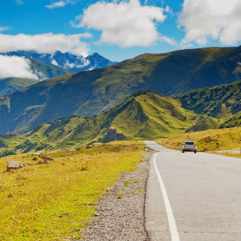 white car travelling in the Georgian mountains in Canada