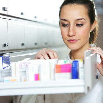woman checking the medicine box