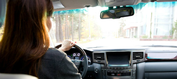 woman driving her new car
