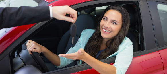 woman accepting car hire keys