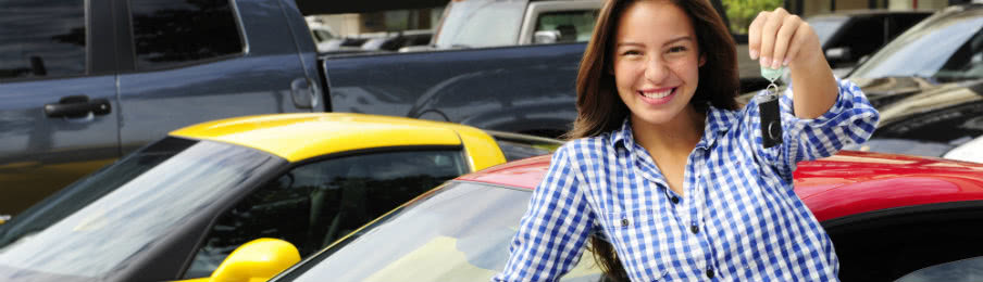 woman showing off her brand new car