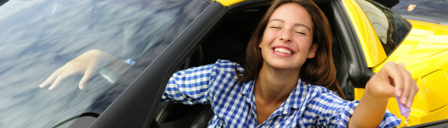 woman showing keys of her car rental luxury car