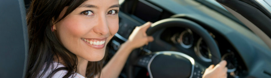 woman smiling while driving