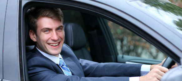 young attractive businessman in the car