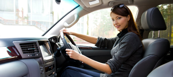 young woman driving a car hire