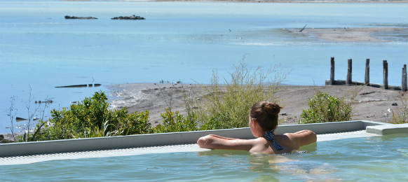 young woman having a spa in outdoors hot pool