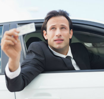 businessman-showing-his-driver-license-dp (1)