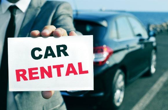 guy-holding-a-car-rental-sign-dp