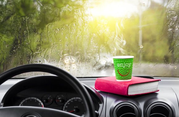 book and coffee in the car
